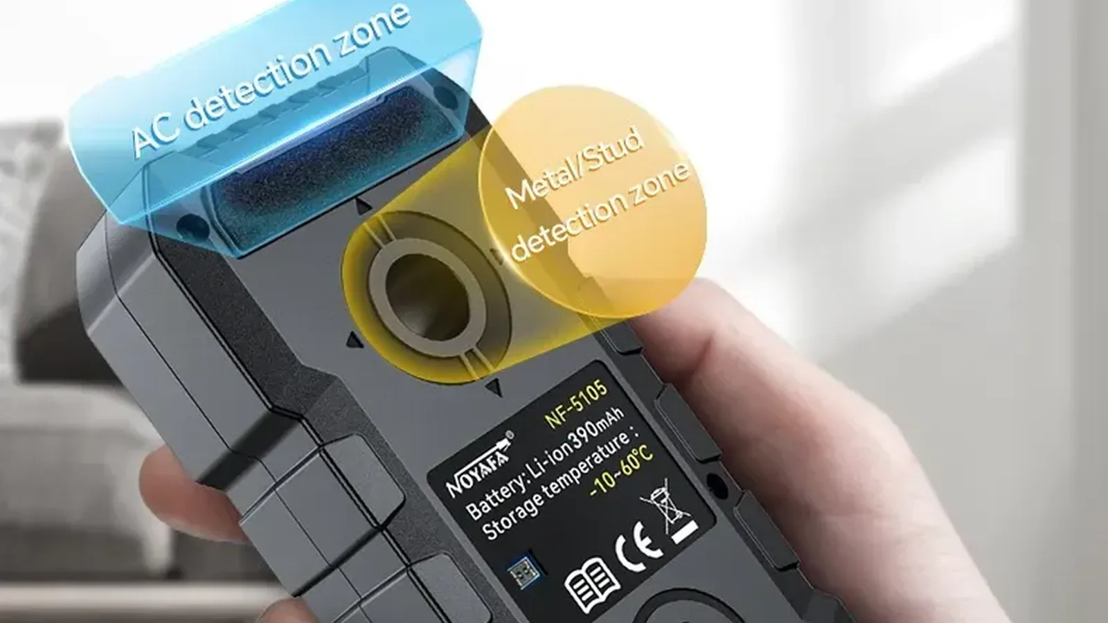 Hand holding a stud finder with detection zone labels